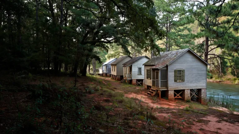 A row of small early-1900s mill village houses on brick piers near the Saluda River in Piedmont, SC